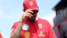 Lewis Hamilton makes his way through the paddock. 
