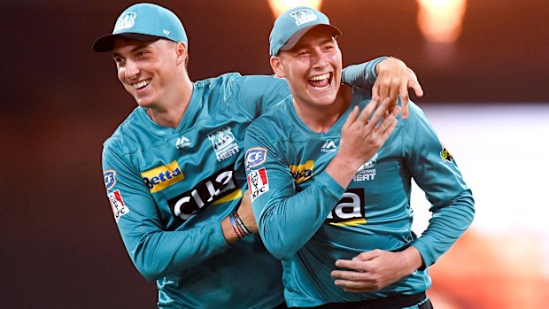 Tom Banton and Matt Renshaw celebrate after Matthew Wade's dismissal is confirmed.