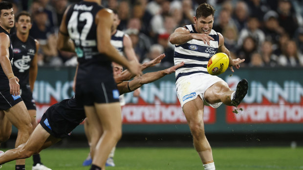 MELBOURNE, AUSTRALIA - MARCH 23: Tom Hawkins of the Cats kicks for goal during the round two AFL match between Carlton Blues and Geelong Cats at Melbourne Cricket Ground, on March 23, 2023, in Melbourne, Australia. (Photo by Daniel Pockett/Getty Images)