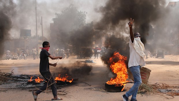 Sudanese demonstrators demand the government's transition to civilian rule in Khartoum, Sudan, Thursday, October 21, 2021.