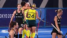 Emily Chalker of Australia celebrates with teammates after scoring.