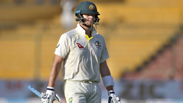 Australia's Steve Smith reacts while he walks pack to pavilion after his dismissal.