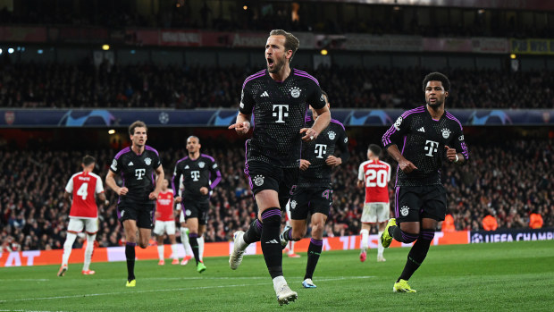Harry Kane of Bayern Munich celebrates scoring his team's second goal from a penalty.
