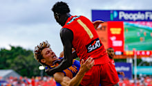 GOLD COAST, AUSTRALIA - MARCH 15: Mac Andrew of the Suns throws Milan Murdock of the Eagles to the ground during the 2026 AFL Round 01 match between the Gold Coast Suns and the West Coast Eagles at People First Stadium on March 15, 2026 in the Gold Coast, Australia. (Photo by Russell Freeman/AFL Photos via Getty Images)