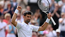 Novak Djokovic celebrates winning match point against Thanasi Kokkinakis.