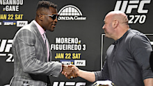 Dana White and Francis Ngannou shake hands. 