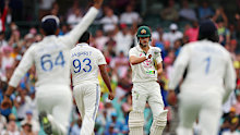 India celebrate around Sam Konstas on day one. 
