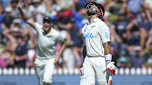 Daryl Mitchell of New Zealand leaves the field after being dismissed.