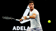 Thanasi Kokkinakis of Australia in action against  Benoit Paire of France.