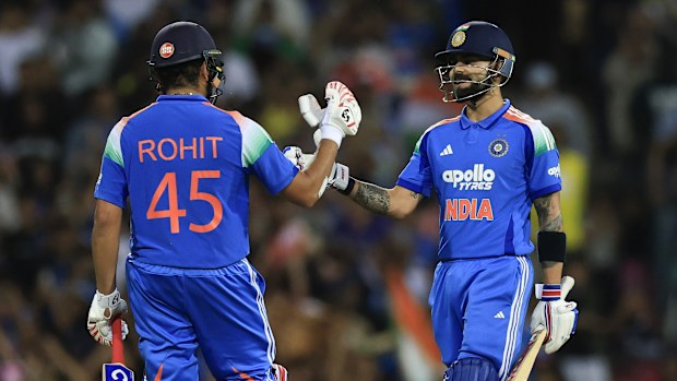 Virat Kohli celebrates with Rohit Sharma.