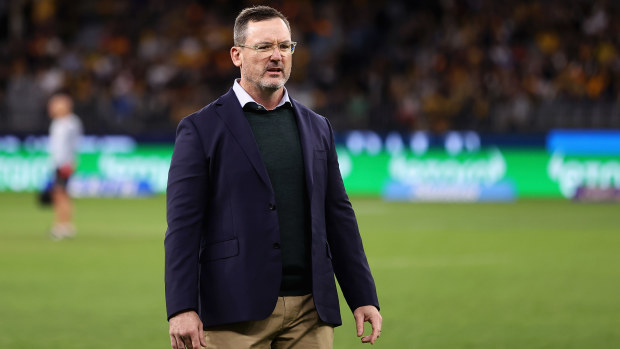 Wallabies forwards coach Dan McKellar watches players warm up.
