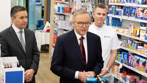 Minister for Health and Aged Care Mark Butler, Prime Minister Anthony Albanese and Trent Twomey, National President, Pharmacy Guild of Australia, at a doorstop interview during a visit to Capital Chemist in Kingston, ACT, on Wednesday 7 September 2022. fedpol Photo: Alex Ellinghausen