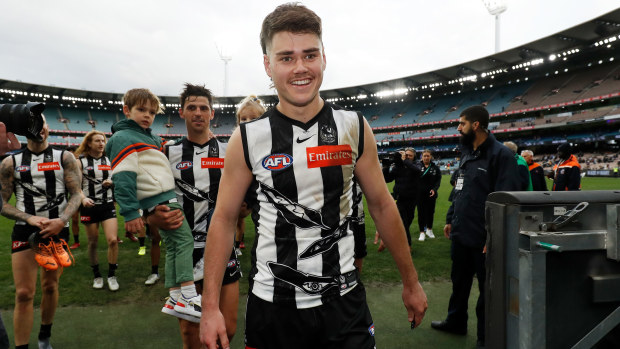 Josh Carmichael celebrates his first AFL win in 2022.