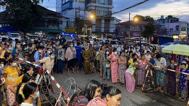 Family members wait for prisoners outside Insein Prison. 
