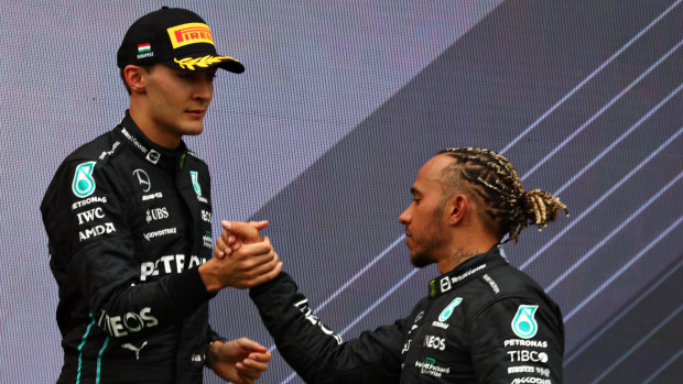 Lewis Hamilton and George Russell on the podium after the F1 Grand Prix of Hungary at Hungaroring on July 31, 2022 in Budapest, Hungary. (Photo by Bryn Lennon - Formula 1/Formula 1 via Getty Images)