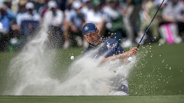 Bryson DeChambeau of the United States plays a stroke from a bunker on the No. 11 hole during the first round of the Masters at Augusta National Golf Club, Thursday, April 09, 2026. (Photo by Kohjiro Kinno/Augusta National/Getty Images)