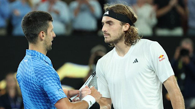 Stefanos Tsitsipas of Greece and Novak Djokovic of Serbia embrace at the net after the Mens Singles Final during day 14 of the 2023 Australian Open at Melbourne Park on January 29, 2023 in Melbourne, Australia. (Photo by Lintao Zhang/Getty Images)