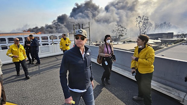California Governor Gavin Newsom surveys damage in during the Palisades Fire on Wednesday, Jan. 8, 2025, in Pacific Palisades, Calif. (Jeff Gritchen/The Orange County Register via AP)