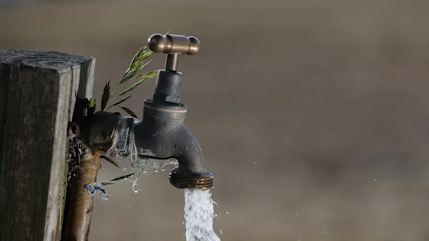 A tap with water coming out of it.