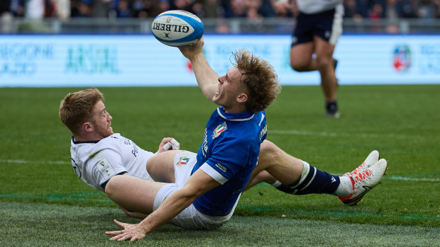 Louis Lynagh of Italy celebrates after scoring a try.