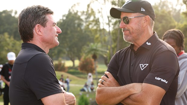 Scott O'Neil CEO of LIV Golf talks to Phil Mickelson of Hyflyers GC after the match on day three of LIV Golf Hong Kong at The Hong Kong Golf Club on March 09, 2025 in Hong Kong, China. (Photo by Zhizhao Wu/Getty Images)