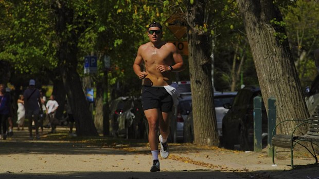 People are seen enjoying the warm weather around the TAMs in Melbourne  on Sunday  13 April 2025. 