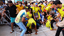 Fans of Colombia and Argentina try to pass the gate amid disturbances ahead of the Copa America 2024 final.