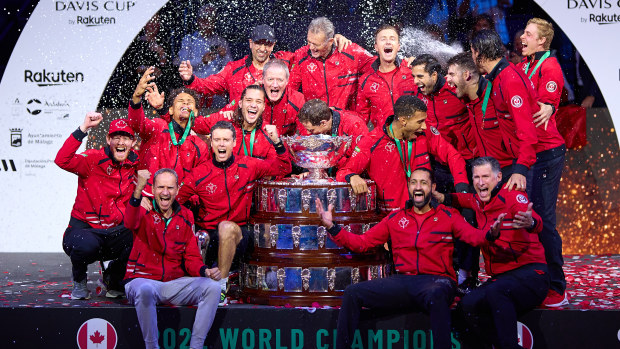 MALAGA, SPAIN - NOVEMBER 27: Players of Canada celebrate with champagne after winning the Davis Cup by Rakuten Finals 2022 Final match between Australia and Canada at Palacio de los Deportes Jose Maria Martin Carpena on November 27, 2022 in Malaga, Spain. (Photo by Fran Santiago/Getty Images)