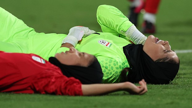 PERTH, AUSTRALIA - OCTOBER 26: Zahra Khajavi of IR Iran is knocked over by Shabnam Behesht of IR Iran during the AFC Women's Asian Olympic Qualifier match between Australia Matildas and IR Iran at HBF Park on October 26, 2023 in Perth, Australia. (Photo by Will Russell/Getty Images)