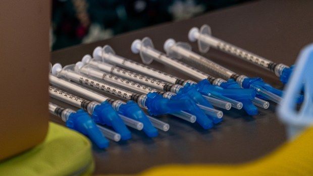 Pfizer-BioNTech Covid-19 vaccine syringes at a vaccination clinic in the Peabody Institute Library in Peabody, Massachusetts, U.S., on Wednesday, Jan. 26, 2022. The state's Covid-19 numbers are improving to the point Massachusetts residents, especially those who are fully vaccinated and boosted, could see significantly lower risk from the coronavirus, according to Tufts Medical Center. Photographer: Vanessa Leroy/Bloomberg