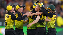 Delissa Kimmince of Australia celebrates with Meg Lanning and her teammates after dismissing Veda Krishnamurthy of India during the Women's T20 World Cup final match between Australia and India at the MCG in Melbourne, Sunday, March 8, 2020. (AAP Image/Scott Barbour) NO ARCHIVING, EDITORIAL USE ONLY, IMAGES TO BE USED FOR NEWS REPORTING PURPOSES ONLY, NO COMMERCIAL USE WHATSOEVER, NO USE IN BOOKS WITHOUT PRIOR WRITTEN CONSENT FROM AAP