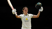 PERTH, AUSTRALIA - FEBRUARY 16: Annabel Sutherland of Australia raises her bat after scoring 100 runs during day two of the Women's Test match between Australia and South Africa at WACA on February 16, 2024 in Perth, Australia. (Photo by Will Russell - CA/Cricket Australia via Getty Images)