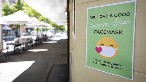 PERTH, AUSTRALIA - DECEMBER 24: A sign on display advises the public to the requirements of face masks on December 24, 2021 in Perth, Australia. The Western Australian government has implemented new COVID-19 restrictions, following the detection of a new community COVID-19 case. From 6pm on Thursday, masks will be mandatory in all public indoor settings in the Perth and Peel regions until December 28th. Authorities are also recommending people wear masks outdoors when physical distance can't be 