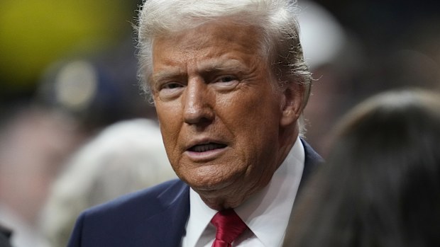 President Donald Trump walks on the sidelines prior to the NFL Super Bowl 59 football game between the Philadelphia Eagles and the Kansas City Chiefs, Sunday, Feb. 9, 2025, in New Orleans. (AP Photo/Ashley Landis)