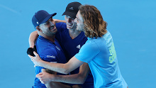 Stefanos Sakellaridis of Greece is surrounded by his team after winning his men's singles match against Zizou Bergs.