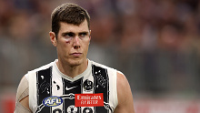 Mason Cox was helped off the ground after a hard collision against Fremantle.