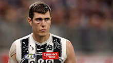 Mason Cox was helped off the ground after a hard collision against Fremantle.