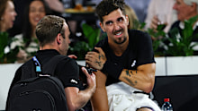 Thanasi Kokkinakis is treated by the physio.