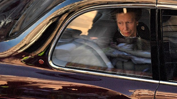 Britain's Princess Anne, Princess Royal looks from the window of a car following the hearse carrying the coffin of Queen Elizabeth II, after leaving from from St Giles' Cathedral on September 13, 2022 in Edinburgh, Scotland. 