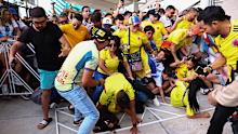 Fans of Colombia and Argentina try to pass the gate amid disturbances ahead of the Copa America 2024 final.
