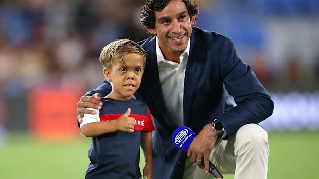 Johnathan Thurston embracing Quaden Bayles.