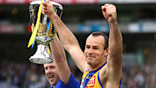 MELBOURNE, AUSTRALIA - SEPTEMBER 29: Adam Simpson, Senior Coach of the Eagles and Eagles captain Shannon Hurn hold the AFL Premiership Cup aloft after winning the 2018 Toyota AFL Grand Final match between the West Coast Eagles and the Collingwood Magpies at the Melbourne Cricket Ground on September 29, 2018 in Melbourne, Australia. (Photo by Cameron Spencer/AFL Media)