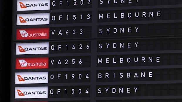 Qantas and Virgin flight details seen on a departure board at Canberra Airport on Thursday 7 September 2023. fedpol Photo: Alex Ellinghausen