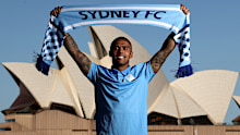 Douglas Costa poses in front of the Sydney Opera House. 