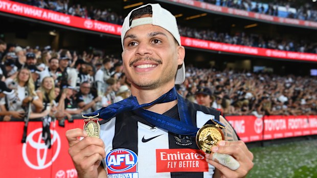 Bobby Hill of the Magpies celebrates winning the Norm Smith Medal in 2023.