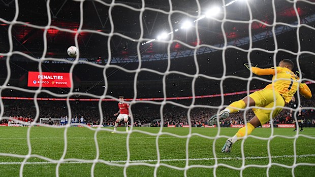Victor Lindelof of Manchester United scores their side's seventh and decisive penalty in the penalty shoot out past Robert Sanchez of Brighton & Hove Albion during the Emirates FA Cup Semi Final match between Brighton & Hove Albion and Manchester United at Wembley Stadium on April 23, 2023 in London, England. (Photo by Mike Hewitt/Getty Images)
