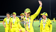 Australia captain Meg Lanning celebrates with the 2022 Women's Cricket World Cup trophy.