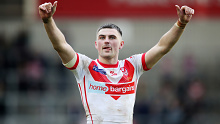 Lewis Dodd gives a thumbs up to fans after a win for St Helens. 