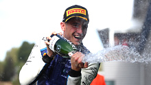 Cropped: Race winner Jack Doohan of Australia and Virtuosi Racing (3) celebrates on the podium during the Round 11:Spa-Francorchamps Feature race of the Formula 2 Championship at Circuit de Spa-Francorchamps on August 28, 2022 in Spa, Belgium. (Photo by Joe Portlock - Formula 1/Formula Motorsport Limited via Getty Images)