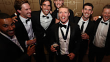 Touk Miller, Noah Anderson, Ben King, Ethan Read, Sam Flanders, Damien Hardwick and Charlie celebrate with Matt Rowell.